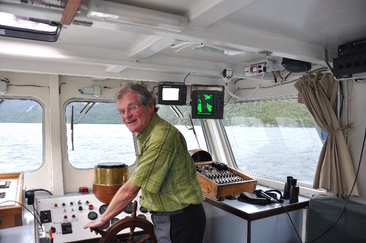 At the helm on the Doubtful Sound