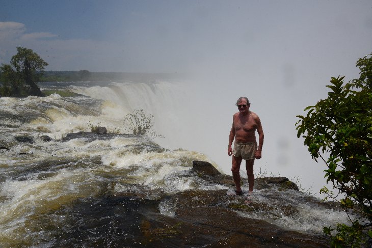Standing on the edge of the Victoria Falls