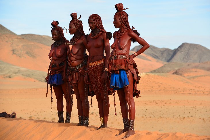 Himba women posing for the tourists