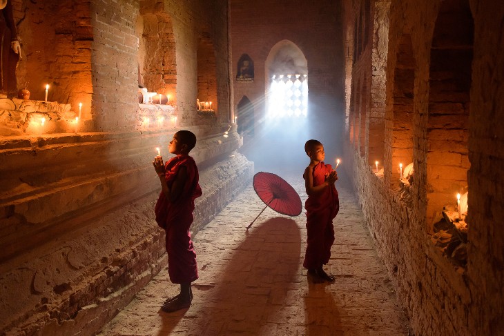 two young novice monks at their devotions